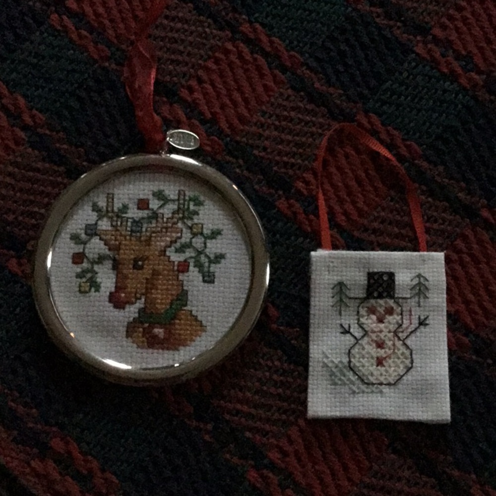 Two handmade cross-stitched ornaments